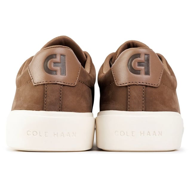 Mens brown Cole Haan grand crosscourt traveler trainers, manufactured with leather and a rubber sole. Featuring: cushioned footbed, durable rubber cupsole, soft leather upper, cole haan branding and comfort fit.