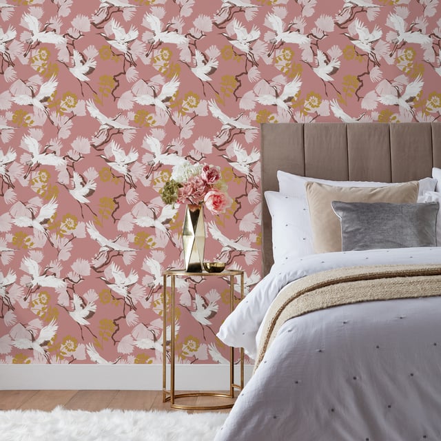 Glide through the air with the majestic birds soaring through tropical foliage with the Demoiselle wallpaper. These Exotic birds fly over an array of quirky leaves in a stunning range of hues and intricate detailing, will make a statement in whichever room you put it in. This wallpaper is a paste the wall application; simply paste the wall, hang your paper, and leave to dry. Each roll is 10m long and 52cm wide. Pattern repeat: 53cm Straight match. Our Demoise wallpaper can be used to paper the whole room or to create an eye-catching feature wall. This wallpaper is also wipeable so that any light marks can be dabbed away.
