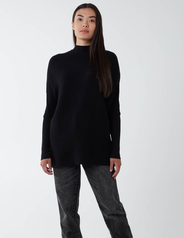 What do we want in Winter? We want to be warm, comfortable and yes€¦ the best we can look anywhere we go. Which why our highly elasticated batwing jumper with a high neckline is a close friend of ours. It's here when we go to work, a casual weekend, or a night out. And it puts us in a particularly good mood when styled with a pleated skirt and high knee boots.