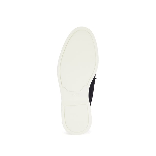 A slip on shoe with suede uppers featuring decorative tassels across the vamp in dark blue suede and all over dark blue stitch details. Two silver branded eyelets situated on the outstep and instep with the signature BOSS logo embossed on the outstep of the heel. A textured rubber midsole in off white with a branded and textured rubber undersole in off white.