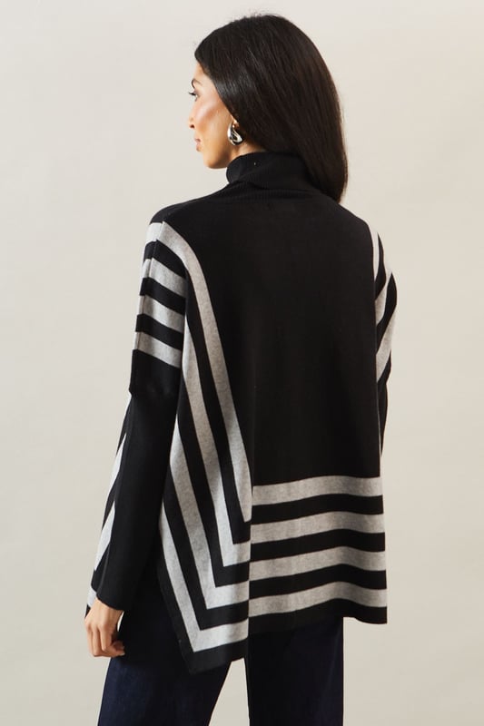 Chic striped roll neck poncho design
        Oversized, relaxed fit for ultimate comfort
        Elegant contrasting stripe pattern
        Long sleeves with dropped shoulders
        Versatile length suitable for various styling options
    
    Embrace sophistication and comfort with this striking striped roll neck poncho from Wallis. The oversized silhouette offers a relaxed fit, perfect for those who appreciate both style and ease. The elegant contrasting stripe pattern adds visual interest, while the long sleeves with dropped shoulders contribute to its laid-back charm. Ideal for casual events and family gatherings, this versatile piece can be styled effortlessly. Pair it with slim-fit trousers and ballet flats for a polished daytime look, or layer it over a fitted dress with ankle boots for a more refined ensemble. The poncho's adaptable length allows for various styling possibilities, making it a wardrobe staple for the fashion-forward woman who values both glamour and practicality in her everyday attire.