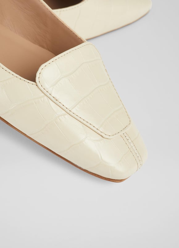 A feminine flat with a loafer feel, our Willow pumps are a stylish hybrid of the two classics. Crafted in Spain from textural croc-effect leather in cream, they have a square toe, loafer styling, a scalloped side cut and a small flat heel. Wear them as an alternative to a ballet pump or loafer on bright spring days.