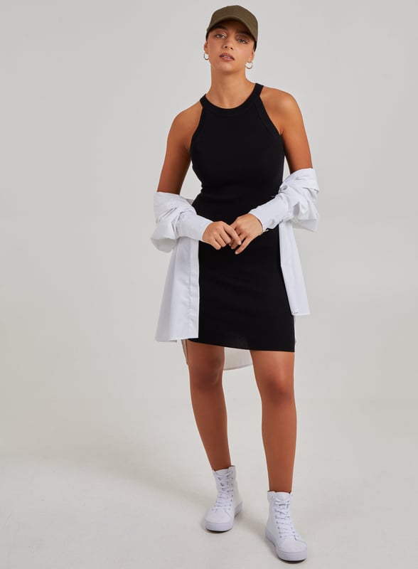 Don't miss out on the party wear piece of the season! This Racer Back Ribbed Mini Dress will keep all eyes on you. Pair with strappy heels for a trend-worthy look.
