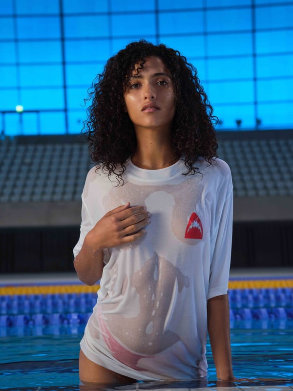 Turn heads in our LET'S SWIM print t-shirt. Featuring our iconic shark head logo on the front and back with brand manifesto printed underneath. Perfect for sharing with your fellow shark obsessed partner.