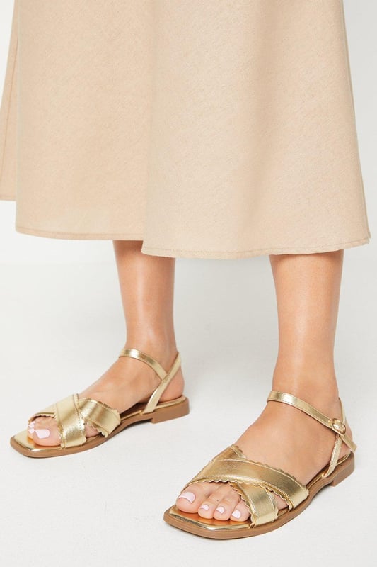 Scalloped flat sandals hot sale