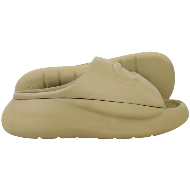 The Lacoste Serve Slide 3.0 223 1 CFA Women's Brown Sliders are a stylish and practical choice for casual wear, poolside lounging, or beach outings. With a sleek design and premium comfort, these sliders offer versatility and durability for everyday use.
Â 
Key Features:
Ergonomic Footbed: 

Contoured design provides superior comfort and support, ensuring a comfortable fit throughout the day.


Durable Synthetic Strap: 

Features the iconic Lacoste crocodile logo embossed for a stylish and recognizable touch.


Slip-On Design: 

Easy to wear, making them perfect for leisure or quick outings.


Textured Rubber Outsole: 

Ensures reliable grip and stability on various surfaces, including wet conditions.


Lightweight Construction: 

Reduces fatigue, making these sliders ideal for extended wear.


Water-Resistant Materials: 

Suitable for pool, shower, or beach environments, withstanding exposure to water.


Elegant Brown Colorway: 

A versatile and modern shade that complements casual and summer outfits.


Â 
The Lacoste Serve Slide 3.0 223 1 CFA Women's Brown Sliders combine iconic branding with everyday functionality, making them an excellent choice for stylish and comfortable footwear during relaxed occasions.
