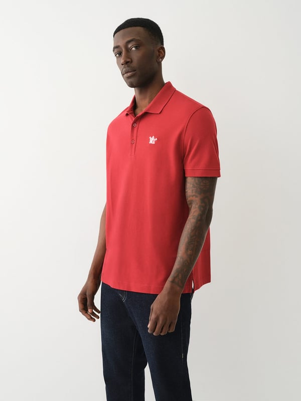 Pop that collar with the Buddha Patched Logo Polo Shirt. Crafted from soft cotton, this men’s polo features a basic collar. half-button placket, and short sleeves. Finished with a relaxed fit, ribbed trim, and a chest Buddha patch.