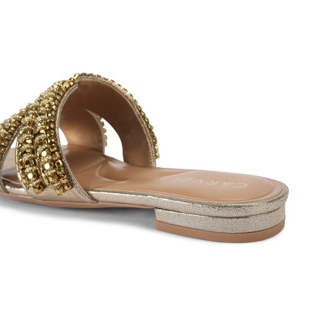 This Carvela Pageant Mule sandal is crafted from a metallic gold fabric and each of the two straps are embellished with statement gold crystals.