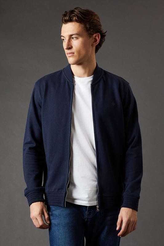 Classic baseball-style jacket design
        Full-length zip closure for versatile wear
        Ribbed collar, cuffs, and hem for a snug fit
        Subtle embroidered logo detail on the chest
        Crafted from pure cotton jersey for comfort
    
    Embrace casual sophistication with this Maine baseball jacket, a versatile addition to your wardrobe. The timeless design marries comfort and style, making it perfect for various casual occasions. Pair it with a crisp white t-shirt and your favourite jeans for a laid-back weekend look, or layer it over a polo shirt for a smart-casual ensemble suitable for family gatherings or informal outings. The pure cotton jersey fabric ensures breathability and ease of movement, ideal for those busy days when comfort is key. For a contemporary twist, try wearing it unzipped over a graphic tee with chinos and trainers. Whether you're heading to a casual lunch or enjoying a relaxed evening with friends, this jacket will keep you looking effortlessly stylish while maintaining that essential comfort factor.