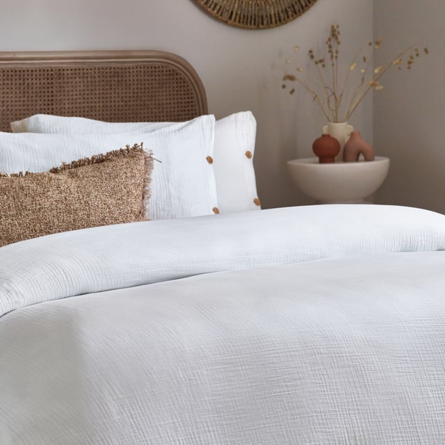 Inspired by timeless classic fabrics, the Lark duvet cover set is made from ultra-soft double-layer muslin cotton fabric. Available in a range of pastel tones, this bedding is complete with a wooden button closure. The cosy crinkle texture is perfect for bringing a relaxed, stylish feel to your bedroom. Cool and breathable in the summer months and snuggly and warm in the winter, muslin is used on both sides for an understated yet modern look. This product is certified by OEKO-TEX®, showing it has been sustainably made.