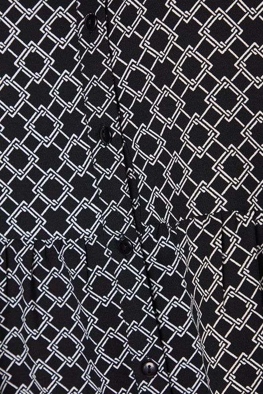 Striking geometric print for a modern, eye-catching look
        Button-through front design for easy wear and versatility
        Flattering peplum silhouette to accentuate the waist
        Voluminous long sleeves for a touch of drama
        V-neckline to elongate the neck and add a feminine touch
    
    This Dorothy Perkins peplum top radiates contemporary charm with its captivating geometric print. The button-through design offers both style and practicality, allowing for effortless dressing and the option to adjust your look. The peplum silhouette gracefully cinches at the waist before flaring out, creating a flattering shape for various body types. Style this versatile piece with slim-fit trousers and white trainers for a chic daytime ensemble perfect for brunching with friends or attending a casual family gathering. For a more polished look, pair it with dark tailored trousers and ballet flats, ideal for those days when you want to feel put-together without compromising on comfort. The long, billowy sleeves add a touch of drama, making this top a standout choice for your wardrobe that transitions seamlessly from day to night.