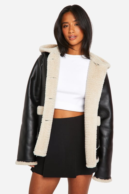 Keep toasty this season with our collection of petite coats and jackets. From petite trench coats to petite teddy coats, our coats for petite women are specifically designed to fit all you girls sitting pretty at 5'3'' and under. Step out in a petite blazer or pass the vibe check in a petite puffer jacket. Whatever your style, we've got you, girl. This one would look dreamy with a pair of straight leg jeans, an oversized hoodie and chunky trainers.Style: Aviator JacketNeckline: Hooded