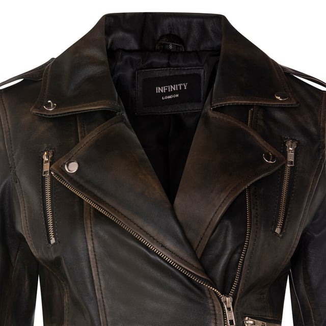 Introducing our best-selling double-breasted biker jacket, a true epitome of style and functionality. Crafted with precision, this jacket is designed to enhance your wardrobe with its sleek features and silhouette, ensuring you stand out effortlessly. Here's why it's a must-have:  
Distinctly Stylish: The jacket's sleek design creates a distinct and fashionable appearance that's perfect for any occasion.
 
Ample Storage: Featuring multiple zip pockets on the front, this jacket not only adds character but also provides extra storage for your essentials.
 
Flamboyant Details: The wide notched lapel and shoulder epaulettes add a touch of flamboyance, fastened down securely with press studs for a polished look.
 
Tailored Fit: Buckle tabs at the hips allow for a comfortable, tapered fit, accentuating your silhouette, complemented by the jacket's slim design. Color Variety: Available in a wide array of colors, you can choose the one that matches your personal style.  Crafted from 100% premium ultra-soft nappa leather and lined with a premium polyester blend, this jacket offers both luxury and comfort. With an off-centered YKK zip fastening, this jacket is as functional as it is stylish, making it a versatile addition to your wardrobe