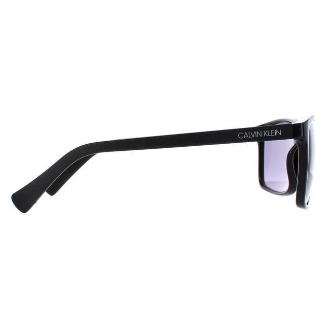 Calvin Klein Rectangle Mens Black Grey Gradient CK19568S  Sunglasses are a sleek and contemporary style that seamlessly blend timeless design with modern sensibilities. Crafted from lightweight aceate, the CK19568S sunglasses showcase Calvin Klein's commitment to quality and innovation. The frame's clean lines and minimalist aesthetic exude an understated elegance that complements any outfit, whether you're dressing up for a special occasion or adding a touch of glamour to your everyday look.