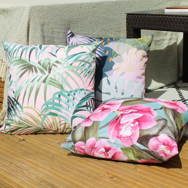 Featuring a bold and abstract design of palm leaves. There is a fully reversible design in pastel pinks and bright green's will instantly freshen up your outdoor space.