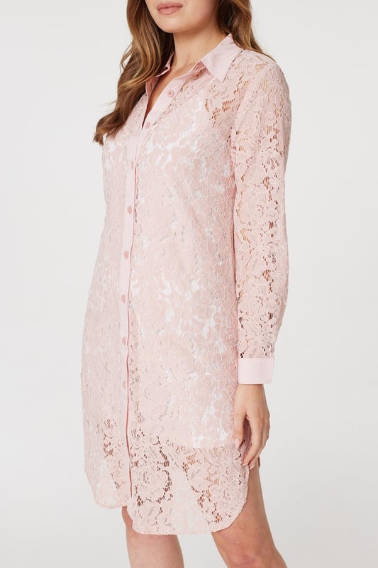 Add a twist to a traditional shirt dress with this sheer lace longline dress. Made from 100% cotton, it has a collar, V-neck, button front, long sleeves with tailored cuffs and a knee length hem. Layer over leggings and pair with your favourite heels, or leave unbuttoned for a chic warm weather alternative to a coat or cardigan.