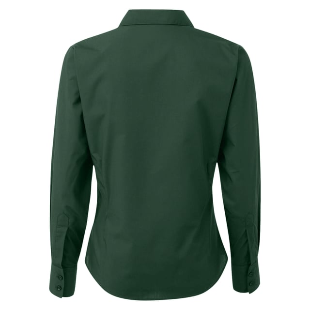Womens easy care long sleeve blouse. Soft collar styling. Rounded bottom hem. Fitted styling with bust and back darts. Pearlised buttons on white shirt, self colour buttons on black. Double buttons on cuff. Size 6*, 8, 10, 12, 14, 16, 18, 20, 22, 24, 26 * size 6 only available in black and white. Bust: 6 - 35.5”, 8 - 37.5”, 10 - 39.5”, 12 - 41.5”, 14 - 43.5”, 16 - 45.5” 18 - 47.5”, 20 - 49.5”, 22 - 51.5”, 24 - 53.5”, 26 - 55.5”. Fabric 65% Polyester, 35% Cotton. Plain Poplin Weave Weight 105gsm