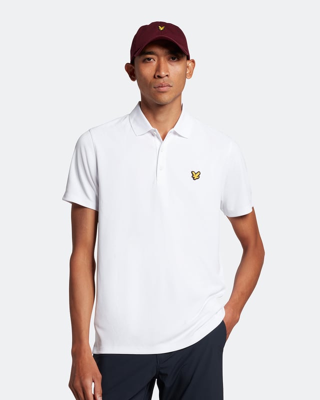 The Lyle &amp; Scott golf tech polo shirt. This regular-fit polo, is made from a recycled polyester blend and designed to be as lightweight as possible, with a three-button placket &amp; detail stitching on the collar and cuff.