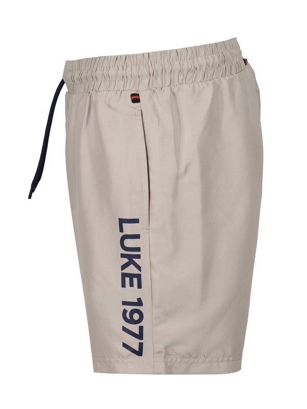 Get poolside-ready with this pair of swim shorts from LUKE. Cut from a quick-drying polyester, they feature a comfy drawcord waist and essential side entry pocket. They are complete with a contrast LUKE 1977 print down the left leg.