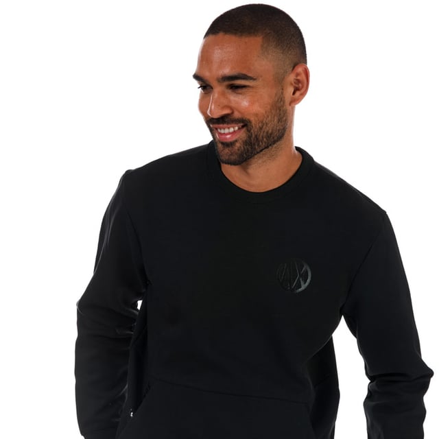 Mens Armani Exchange Placed Print Colourblock Sweatshirt in black.- Crew neck.- Long sleeves.- Front kangaroo pocket.- Colorblocking at backs of arms.- AX logo on chest.- 69% Cotton  31% Polyester. Machine washable. - Ref: 3ZZMANJQ2Z1200