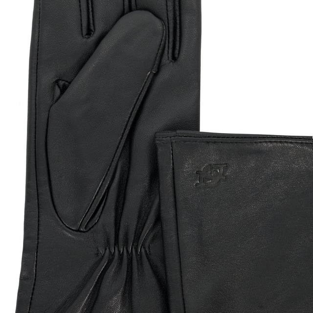 Embrace elegance this winter with Impressive. Crafted from the finest leather, these gloves feature sophisticated ruched details at the inner wrist, ensuring you stay chic and warm throughout the season. The extended length offers additional coverage, making them as practical as they are stylish.