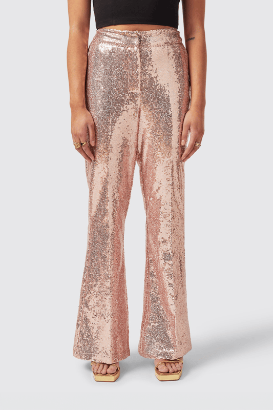 The Caladium Trouser in Rose Gold is a go-to party and event favourite. Adorned with shimmering sequins, It's guaranteed to turn heads as soon as you enter the room. Cut to a slim fit with a flared leg, it's the perfect pair of trousers with a rose gold twist. Pair it with the matching Caladium Jacket in Rose Gold to complete the full look.