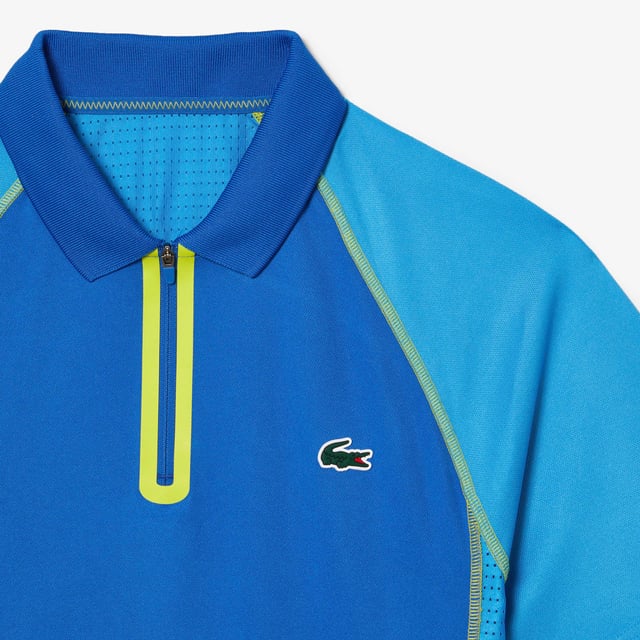 Performance & Assets Players The player’s offer is the perfect outfit to perform on court. It’s a mix of heritage’ Lacoste design and technical fabrics. Regular fit: natural ease on body Team Lacoste Players' polo dedicated to ATP tournaments New light piqué knit for a maximum of comfort during your matches under high temperatures Functional mesh panels at sides and back for breathability Ultradry property : moisture management performance you need to play at your best Eco responsible fabric : recycled polyester Contrasted flat seams in order to reduce skin irritation when you play New green silicone crocodile New grand tournament Lacoste wording at back neckline with herringbone effect