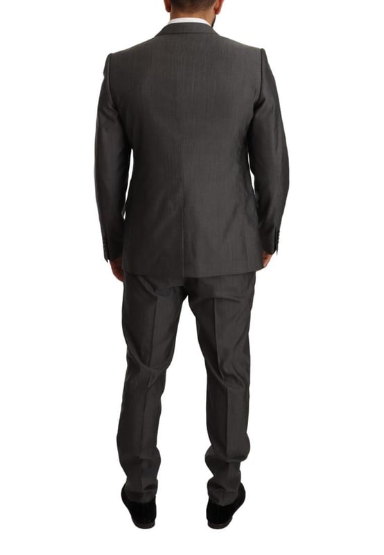 100% Authentic Dolce & Gabbana Suit
  Model: MARTINI
  Style: Single breasted 2 piece suit; includes blazer and pants
  Color: Gray metallic
  Closure: Two button closure
  Fitting: Slim fit
  Two inside pockets
  One open vent in the back
  3-way pants zipper closure
  Logo details
  Made in Italy
  Material: 65% Wool 35% Silk
  Lining: 100% Rayon