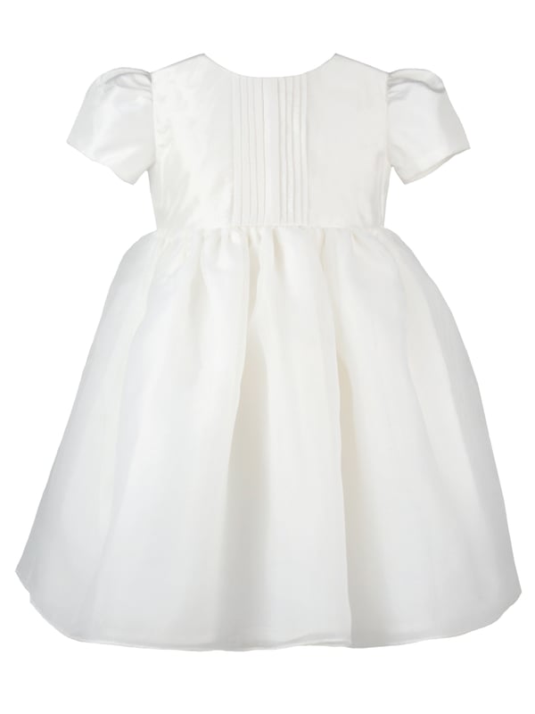 Perfect for Flower Girls, Bridesmaids or Special occasion!
'Dolly' evolved from one of our most popular dresses.

It has been beautifully re-designed to include our pin tuck detailed front, button back and gorgeous puffed sleeves to create the prettiest of dresses that is as comfortable as it is fun. Team it with a sash, ribbon or flower in any colour to match your colour scheme.

You'll find all our dresses are lined in cotton lawn for extra softness and perfect for sensitive skin.

The dress will arrive with you on a Satin padded hanger and covered in one of our Heritage garment protector bags for safe keeping.

Outer - 100% Mock Silk polyester fabric and trims

Lining - 100% cotton

Dry Clean or Hand Wash