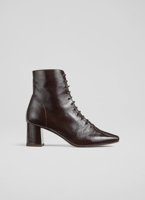 Experience sophistication with every stride. Our Arabella lace-up ankle boots in rich espresso crinkled patent boast a stylish square toe and a sturdy block heel, all exquisitely lined with leather. Perfect for smart-casual ensembles, pair them with tailored trousers or your favourite dress. These lace-up ankle boots are the epitome of style and function. Made in Spain.