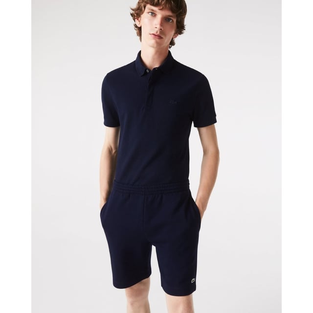 PRODUCT REF. GH9627-00 Efficient. Durable. Comfortable. An iconic, performance-enhancing essential that's comfortable enough to relax in. Regular fit, straight cut: Unrestricted freedom of movement. Drawstring waist: An adjustable waistband for optimum comfort. Back pocket with piping: Practical and functional. Embroidered crocodile on the front: Lacoste-typical performance. Brushed organic cotton fleece: Long-lasting comfort during sports. Main material: cotton (84%), polyester (16%) / pocket lining: cotton (100%)