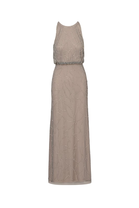 Timelessly sparkle at your next formal event in this blouson gown. This formal dress features a sleeveless blouson bodice, a halter neckline, and a mermaid skirt. Fully lined, this evening gown is designed with mesh knit fabric that is fully embellished with sequin and beaded floral deco patterns. A hidden zipper closure at the centre back completes this sleeveless gown. Paired with nude heels and simple accessories, this beaded dress is ideal for black-tie events or bridal parties.