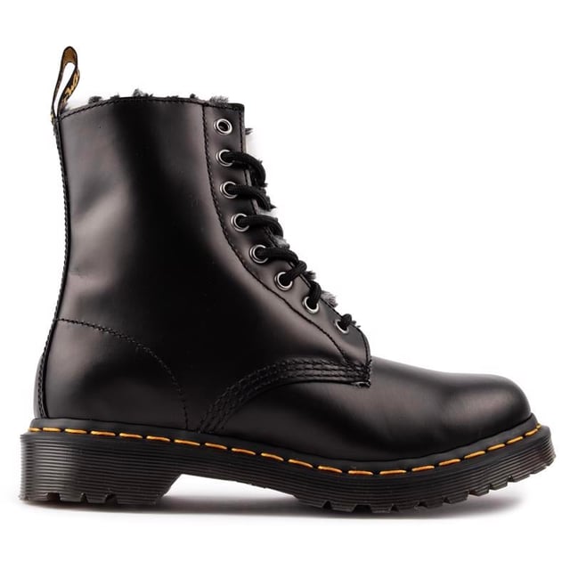 Women's Black Dr. Martens 1460 Serena Lace-up Boots, With A Leather Upper, Featuring An 8-eyelet Lacing System And Signature Airwair Heel Loop. These Ladies' High-top Boots Have A Soft Faux Fur Lining, The Unmistakable Doc's Dna Like The Iconic Yellow Stitching, Airwair Branding And The Goodyear Welted Air-cushioned Sole With Rugged Tread.
