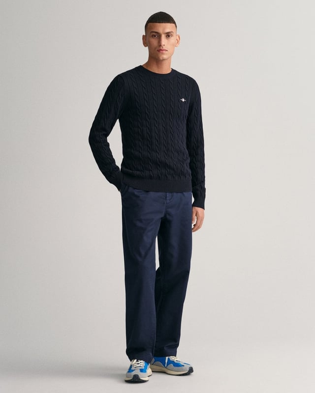 Designed in a soft cotton all-over cable knit, this sweater features our classic GANT shield embroidered at the chest, and ribbed endings at the hem and cuffs. A cable knit sweater adds a dimension of texture to your ensemble and pairs well with jeans and pants alike.
Regular fit  Crew neck  GANT graphic embroidered at chest
&nbsp;
Cotton 100%
&nbsp;
8050601
&nbsp;
&nbsp;