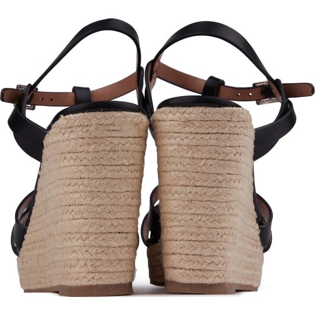 Sandalias alpargatas con cuña Solesister desri de mujer en color negro, fabricadas en sintético y suela sintética. Composición: alpargata con cuña y plataforma y forro y calcetín sintético.