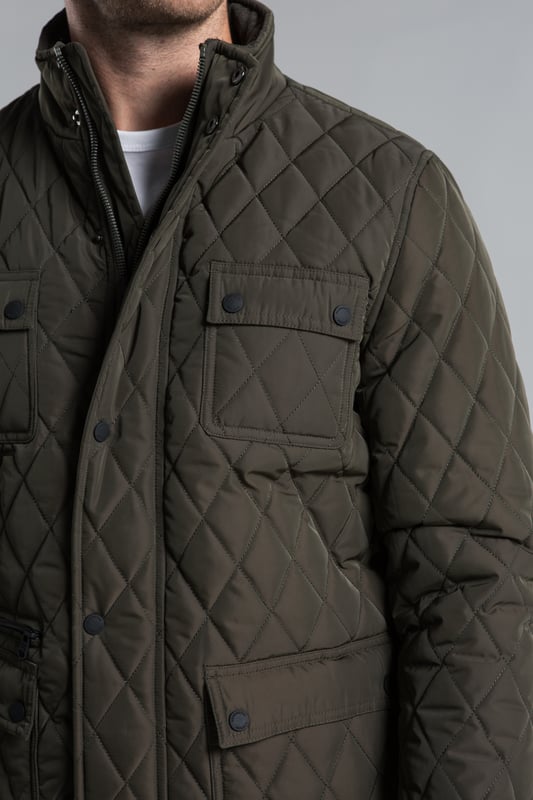 Stay warm and stylish with this diamond-style padded jacket from Kensington Eastside, featuring a button and zip-up fastening for ultimate comfort. With a funnel neck and four front pockets, this jacket is perfect for keeping your essentials close by. Ideal for outdoor adventures or casual wear, it's a must-have addition to your wardrobe this season.