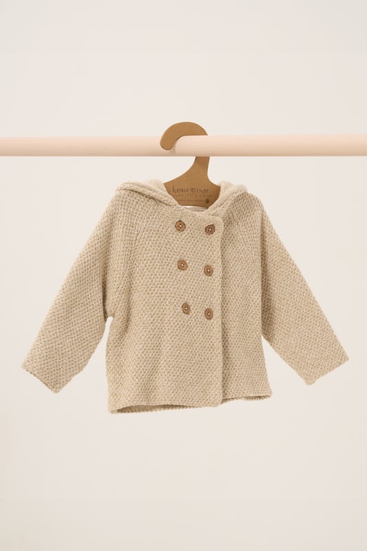 Homegrown's organic cotton hooded wrap cardigan is crafted for comfort and sustainability. Featuring button fastening and cute bear ears on the hood, this cosy, breathable cardigan is gentle on delicate skin and perfect for any season.