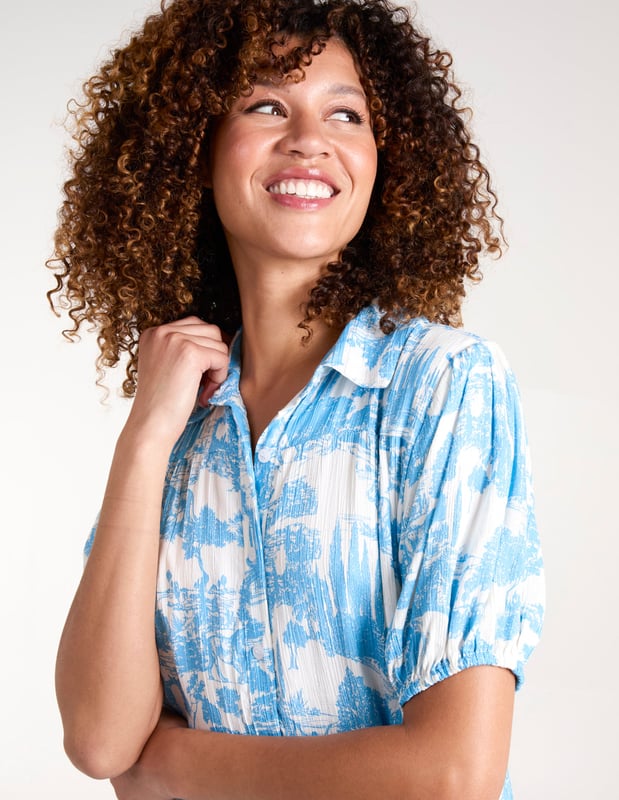 Soft and light mini smock shirt dress with a lovely summer print.