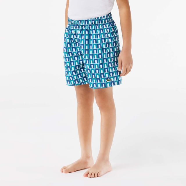 Monogram Print Swim Trunks Recycled polyester made from manufacturing offcuts Elasticated waist Embroidered crocodile on leg   Monogram Print Swim Trunks Recycled polyester made from manufacturing offcuts Elasticated waist Embroidered crocodile on leg