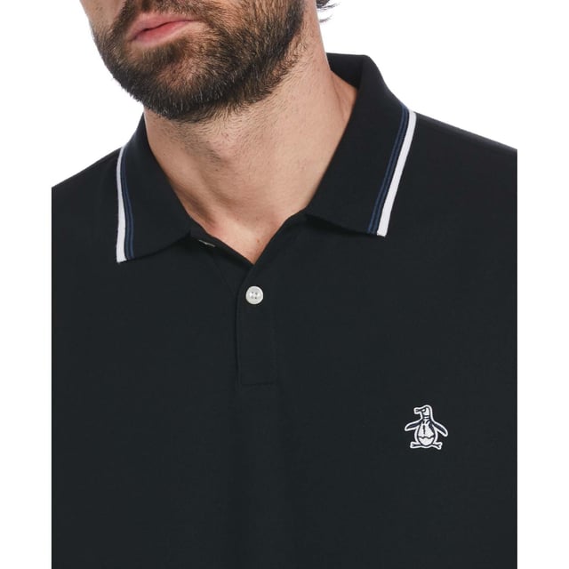 Every guy needs a solid polo shirt in their wardrobe and this Original Penguin one has you covered for style and comfort. Made from 100% organic cotton  it's soft and breathable and pique fabrication creates a subtle texture you can see and feel. A tipped collar pulls the look together and Pete offers his stamp of approval on the chest. Pair it up with jeans  chinos  or shorts  it's a versatile short sleeve top perfect for hanging with your buddies or going out for date night