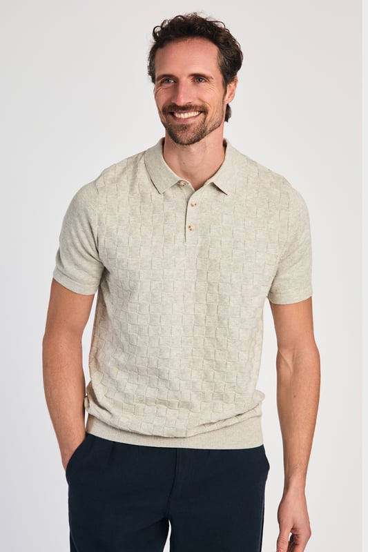 Beige Cotton Short Sleeve Button-Up Polo Shirt This textured polo shirt from Nines Collection blends classic sophistication with modern design. Crafted from a premium cable fabric with a subtle pattern, it offers a refined yet contemporary look. Lightweight and breathable, it’s a versatile choice for smart-casual occasions, ensuring style and comfort effortlessly. Made from 100% Cotton.