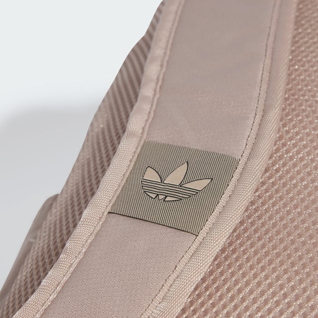 Loaded for your daily adventures, this adidas backpack moves easily through your day. Stash your laptop, water bottle and whatever else you need in the roomy main compartment, while smaller items find their place in the front zip pocket and side slip-ins. Adjust the padded straps for custom comfort and you'll breeze through your routine with this versatile everyday essential.This product is made with at least 50% recycled materials. By reusing materials that have already been created, adidas help to reduce waste and our reliance on finite resources and reduce the footprint of the products adidas make.  - Dimensions: 15 cm x 27 cm x 43 cm - Volume: 20.25 L - 100% polyester (recycled) - Zip main compartment - Front zip pocket - Side slip-in pockets - Inner slip-in pocket - Padded adjustable shoulder straps  Shipped by adidas