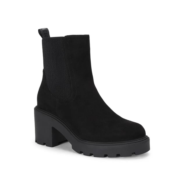 The KG Kurt Geiger Turin boot features a black microsuede upper with elasticated panels at the sides. There is a KG Kurt Geiger branded tab at the back of the ankle for slip on ability. Heel height: 7cm.