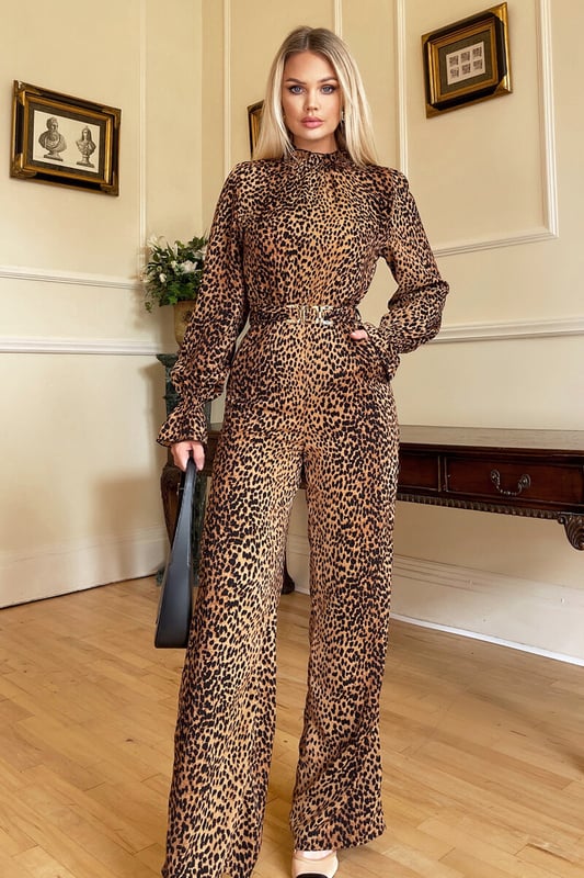 Our Camel Animal Belted Frill Cuff Sleeve Jumpsuit is perfect to throw
on and go whilst still looking put together, designed in a classic
animal print which will never go out of style . Featuring a Gold
Statement belt, a high frill trim neck, and a zip up back! Dress up
with heels for an evening look or wear with flats for a day time look.

Model wears: UK 8/ EU 36/ US 4

Model's height: 170cm/ 5'7"

Approx length from centre back to hem: 159cm

Fabric composition: 100% Polyester 

Colour:  CAMEL