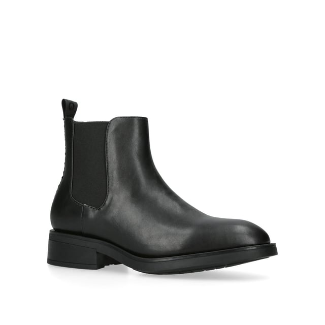 The KG Kurt Geiger Tiffany Chelsea boot features a black leather upper with two elasticated panels at the sides of the ankle. There is a KG Kurt Geiger tab at the back of the ankle with gunmetal stud on top.
