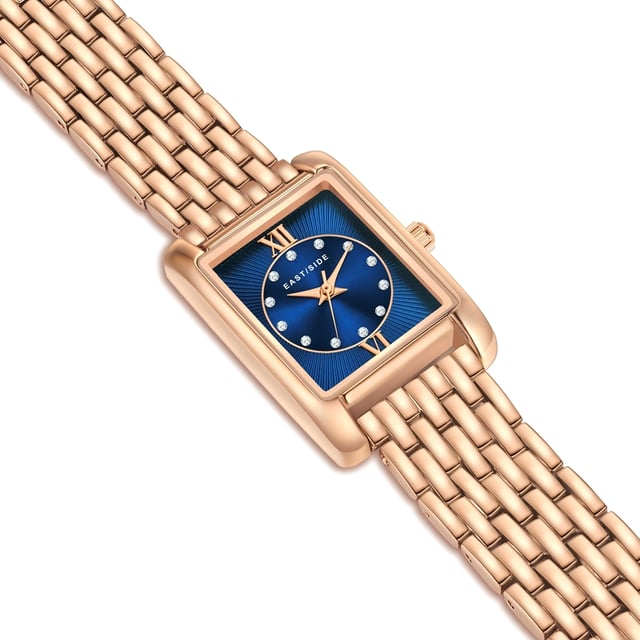 GENERAL INFORMATION:  • Targetgroup: Female  • Wristwatch: No Special Functions  • Display: analogue  • Weight of watch w/o box (gr.) - approx.: 55,0  MOVEMENT:  • Movement: Quartz  • Term of Movement: 2035  • Origin of movement: Japan  BRACELET:  • Material of bracelet/strap: Metal (Alloy)  • Plating of bracelet/strap: Ion-Plating (IP)  • Finishing of bracelet/strap: Smooth  • Finishing/Decoration of bracelet/strap: None  • Clasp/Closure/Buckle: Security-folding clasp  • Color of bracelet/strap: Rosegold  • Length of bracelet/strap (mm) approx.: 210,0  • Width of bracelet/strap (mm) approx.: 13,4  • Style/Design of bracelet/strap: Link bracelet  • Bracelet/strap adjustable?: No  CASE:  • Shape of case: Rectangular  • Size/Diameter of case in mm . approx.: 20,5 x 30,8  • Height of case in mm: 8,4  • Case material: Metal (Alloy)  • Surface of case: Polished  • Bezel/Topring: Fixed  • Finishing/Decoration of case: None  • Material of case back: Stainless steel  • Lock of case back: No screwed-in crown  • Color of case: Rosegold  • Coating/Plating (Case): Ion-Plating (IP)  • Type/Form of crystal: Flat  • Material of crystal: Mineral crystal  DIAL:  • Size jewelry care cloth: Hour, Minute, Second  • Indices: Roman numerals/points  • Material of dial: Brass  • Structure/pattern of dial: Flat/sunray  • Color of dial: Blue  PUSHER, CROWN, HAND:  • Pusher: None  • Corrector: No  • Crown: No screwed-in crown  • Type of hands: Dauphine hands  • Luminescent (hands): No  PACKAGING & SCOPE OF DELIVERY:  • Box: Yes  • Service booklet: Yes  • Manual: Yes