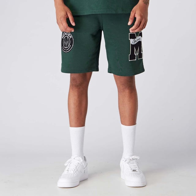 Mens Mercier Academy Shorts in green.- Elasticised waistband.- Open pockets.- Applique logos on leg.- Regular fit.- 65% Cotton  35% Polyester.- Ref: MERC150GREEN