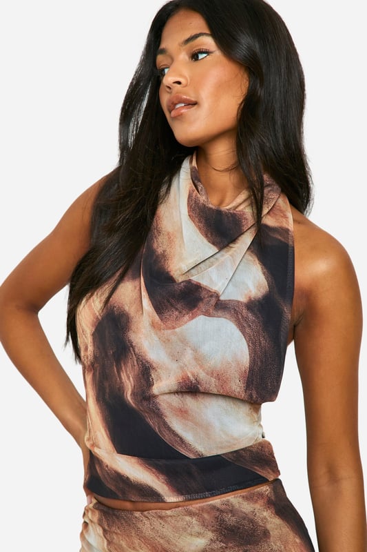 Tall ladies, meet your new go-to tops. Featuring failsafe basics, achingly-cool tees, wow-worthy bodysuits, and many more, the boohoo tall tops collection includes all of the core pieces your wardrobe is missing. Stock up on tall blouses to wear with your fave jeans or choose a tall t shirt that can be worn with everything from joggers to skirts. Our long length tops were made with tall girls in mind...we got you.Style: TopDesign: AbstractFabric: MeshNeckline: Cowl