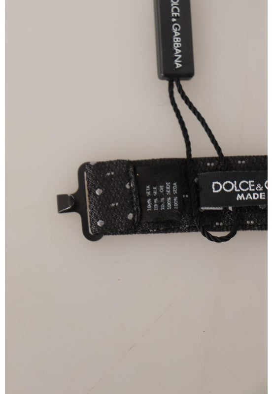 100% Authentic Dolce & Gabbana Silk Bow Tie
  Color: Black and Gray Polka Dot
  Model: Tied
  Material: 100% Silk
  Adjustable length neck strap one size
  Made In Italy
  Width: 6cm
Material: 100% Silk