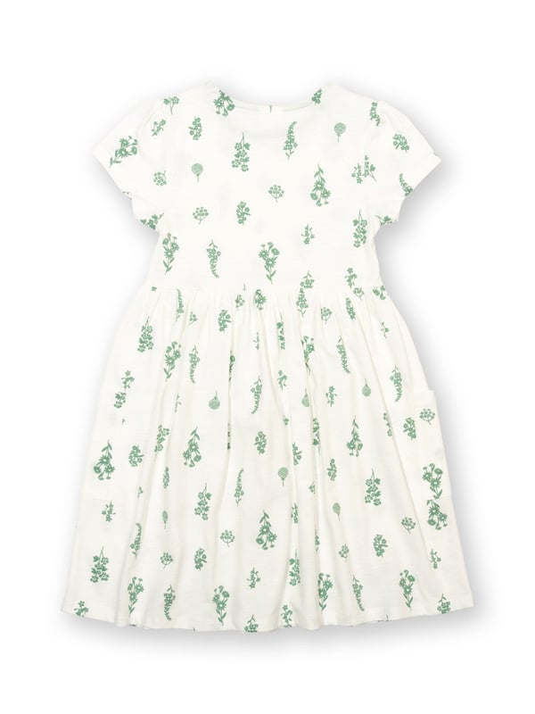 100% organic cotton | Proud to be certified to the Global Organic Textile Standard (GOTS) | Wildflower all-over print | Cream | Slub jersey (170-180 gsm) | Coconut button shoulder opening (up to and including size 3 years) | Side patch pockets | Short sleeved | Round neck | Made in Turkey | Machine washable at 40 degrees, or at 30 degrees to be kinder to the planet